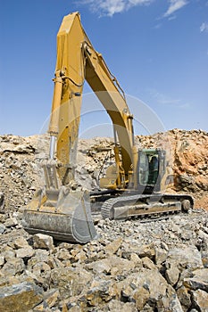 Tracked excavator in a quarry