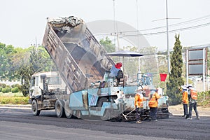 tracked paver at asphalt pavement works for road