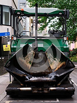 Tracked paver parked on the road