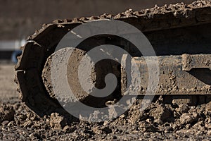 Tracked vehicle on the construction site close up