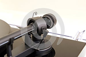 Tracking force adjustment wheel on a vinyl turntable record player
