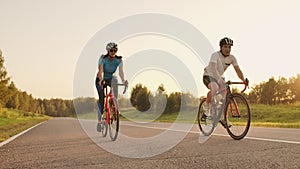 Tracking shot of a group of cyclists on country road. Fully released for commercial use