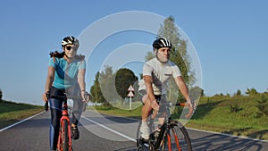 Tracking shot of a group of cyclists on country road. Fully released for commercial use