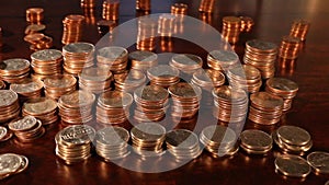 Tracking shot of stacks of American Quarters, Dimes, Nickles - Saving Money - Tight Focus