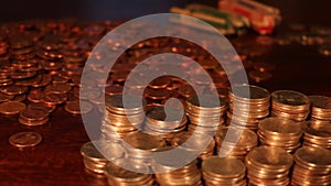 Tracking shot of stacks of American Quarters, Dimes, Nickles - Saving Money - Tight Focus