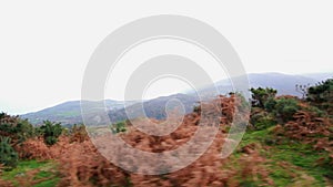 Tracking video of Llanberis and Valley from mountain road, Snowdonia or Eryri, North Wales, UK, landscape