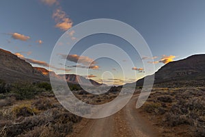 Tracks in dry valley in Karoo after sunset