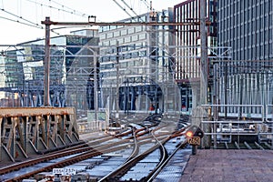 tracks and signs on the end of the platforms at Amsterdam Central station