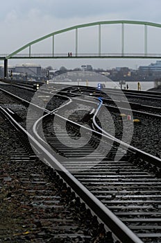 tracks with trains in a distance that are on each other