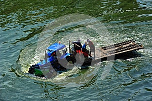 Tracter drove on flood in Bangkok