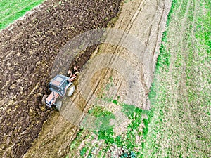 Tractor and agricultural machine, plowing of the field