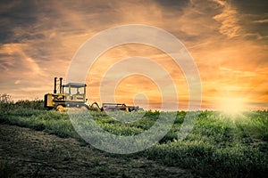Tractor and amazing sunset