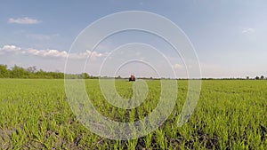 Tractor applying herbicide