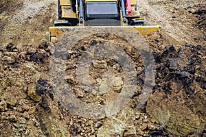 Tractor with with backhoe for earthmoving works