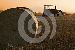 Tractor and bale of hay