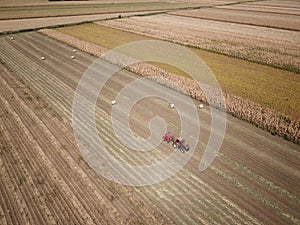 Tractor baling hay