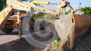 Tractor bucket close-up. Heavy metal teeth of excavator shovel. Scoop equipment. Machinery construction. Industry