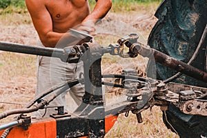 Tractor and cardan shaft for coupling equipment, tractor in the field during haymaking