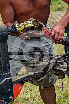 Tractor and cardan shaft for coupling equipment, tractor in the field during haymaking