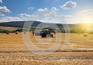 Tractor carrying hay at the field