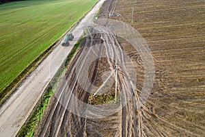 The tractor carrying organic fertilizer top view from drone.