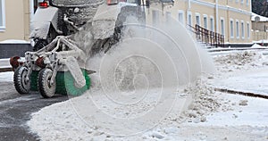 Tractor clearing snow. Blowout of snow powder from snow removal