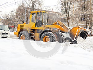 Tractor clears snow in the winter