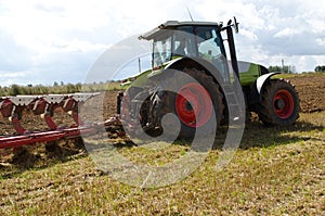 Tractor closeup plow furrow agriculture field