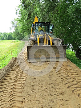 Tractor compares embankments photo