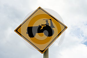 Tractor Crossing Warning or Tractor Ahead Sign in Miyako island, Okinawa, Japan