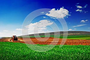 Tractor cultivating 2 photo