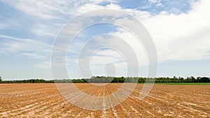 A tractor cultivating farmland in rural Georgia fresh soil