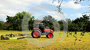 Tractor cutting grass