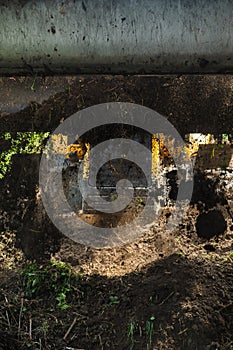 A tractor doing land leveling by a private cottage