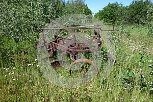 A tractor-drawn plow