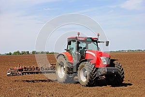 Tractor on a farmland photo