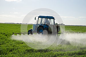 Tractor fertilize field pesticide and insecticide