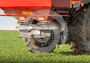 tractor fertilizing in field