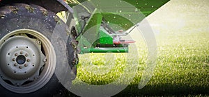 Tractor fertilizing in field