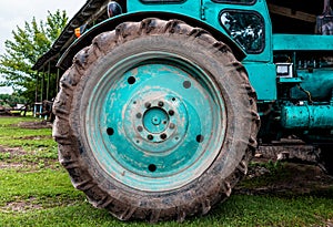 Tractor on the field cultivating and preparing arable land for the next season. Agronomy concept