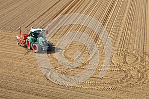 Tractor in aerial view in a field