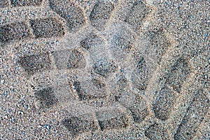Tractor footprint on the beach, well defined, isolated and big