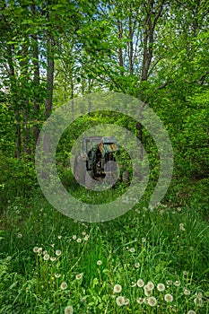 tractor in the forest in a clearing