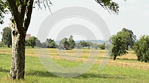 Tractor harrows a field