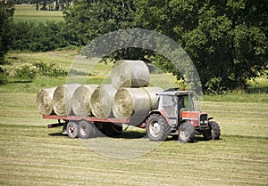 Tractor with hay bales photo