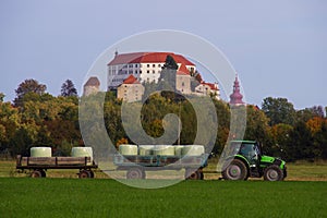 Tractor With Hay Bales And Medieval Castle, Slovenia