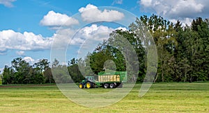 Tractor at the hay harvesting agriculture