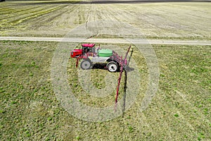 Tractor with high clearance for watering plants in the fields