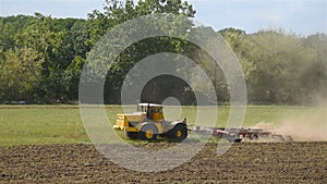 Tractor on land cultivating.