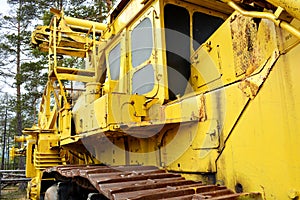 Tractor for laying yellow cables from the left